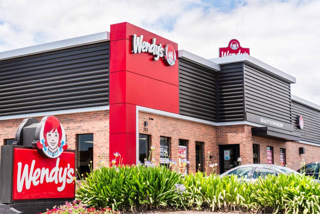 wendy's building with shrubbary in front and wendy's signage By Sundry Photography