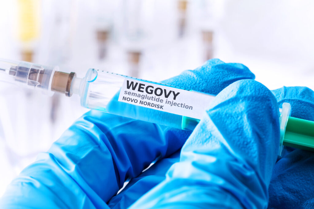 wegovy semaglitide injection novo nordisk syringe in nitrile glove hand 